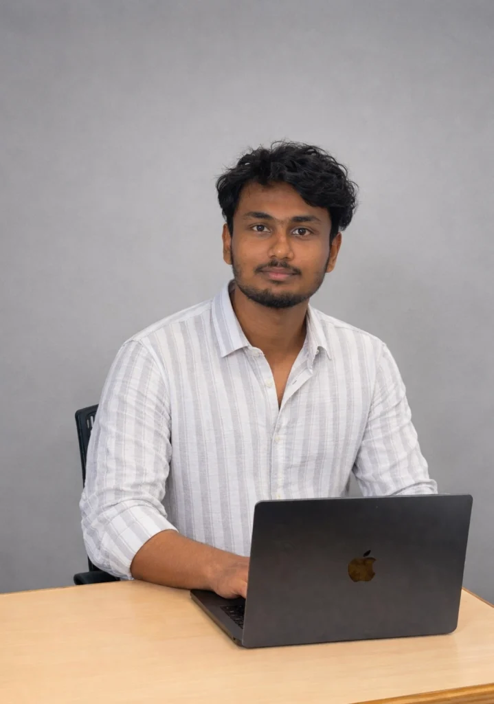 Best Digital Marketing Specialist In Alappuzha working on a laptop at the office desk.